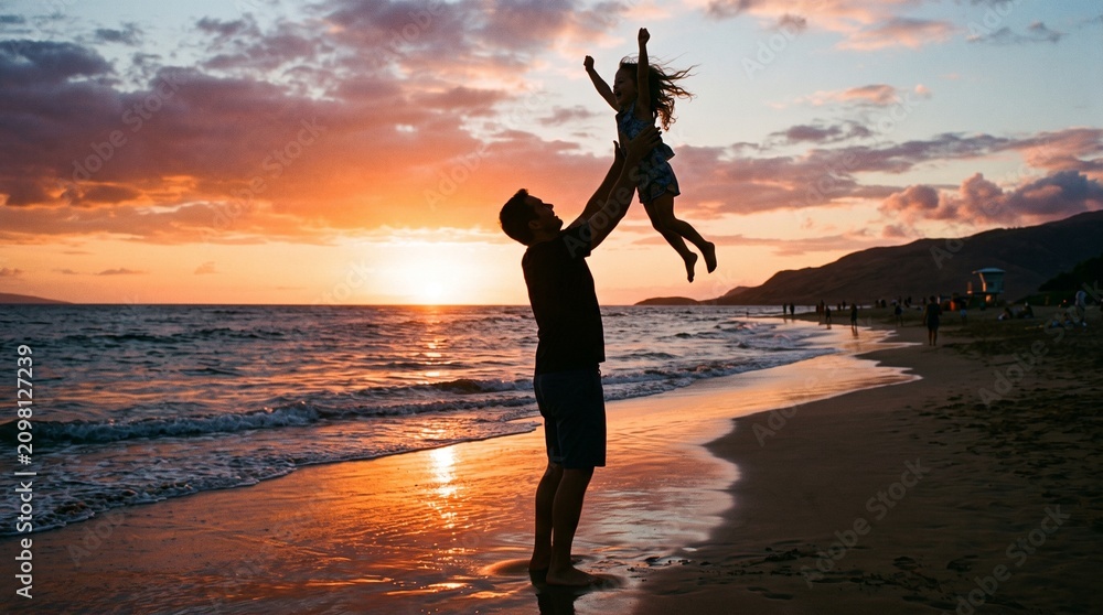 Fototapeta premium Father throws daughter in the air on a beach at sunset with ocean waves