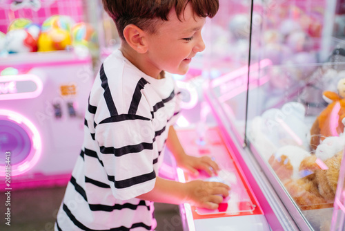Fotografija Kid having fun in entertainment center