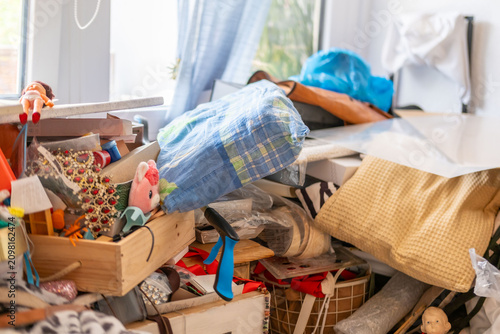 фотографія cluttered room with piles clothes and objects, chaotic interior, hoarding disord
