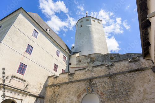 Foto Esterhazy Castle stands magnificently against a bright blue sky with white cloud