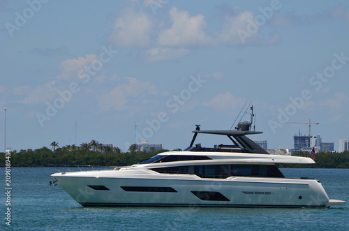 Luxury Yacht Idling on the Florida Intracoastal Waterway Waaiting for the Venetia Causeway drawbridge to open for boat traffic.
