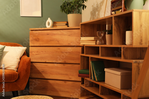 Bookshelf with plants in li...