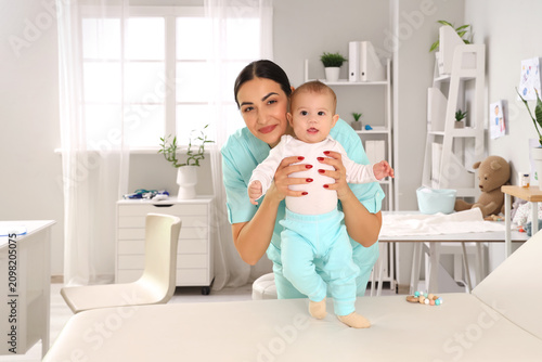 Female pediatrician with li...