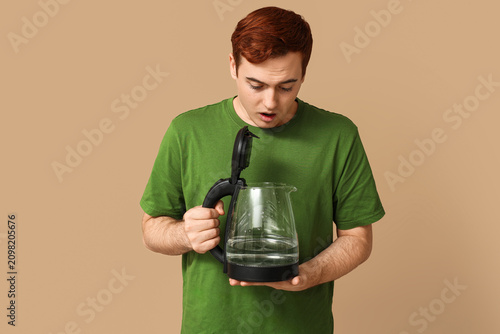 Shocked young man with mode...