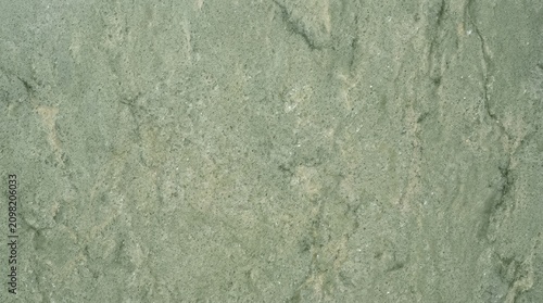Close-up of Green Textured Concrete Surface for Background or Design Use.
