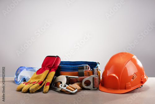 Personal protection equipment on gray background with copy space.