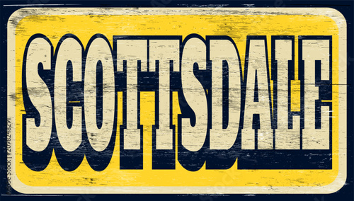 Aged and worn Scottsdale sign on wood