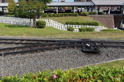 Kyushu Railway History Museum outdoor exhibition miniature train track switch on the ground in Fukuoka, Japan, May 13, 2026