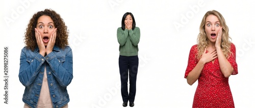 Three shocked women with surprised expressions isolated on white background