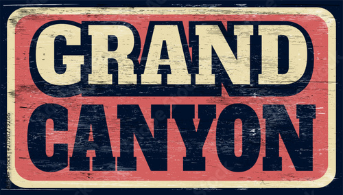 Aged and worn retro Grand Canyon sign on wood