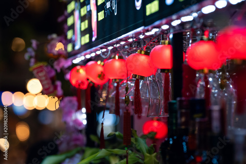 Canvas Print Festive Phu Quoc bar counter with lanterns, glasses, flowers, and warm tropical