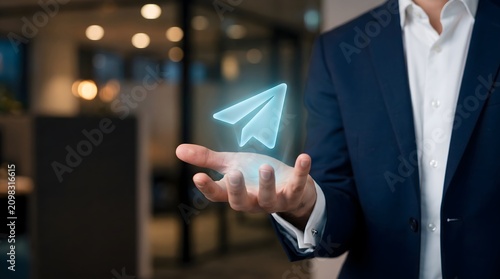 Business Hand Holding Paper Airplane Hologram – Digital Communication, Message Sending and Online Network Concept
