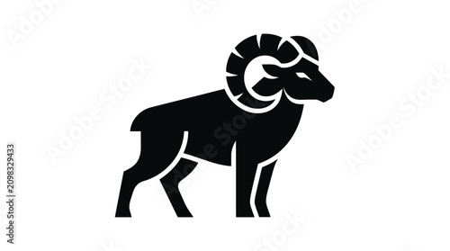 фотографія Black Silhouette of a Ram with Large Curved Horns.
