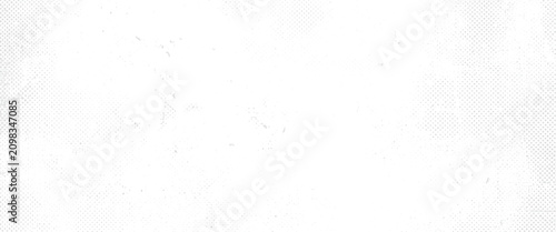 Faded halftone dot pattern with scattered specks and subtle grunge texture abstract background