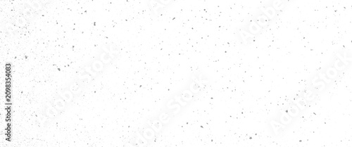 Fotografie Scattered grey speckle texture on white background abstract pattern black blur b