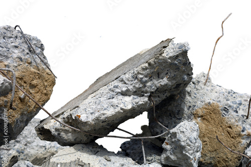 Fotografie A pile of broken concrete debris with rough textures isolated on a white background
