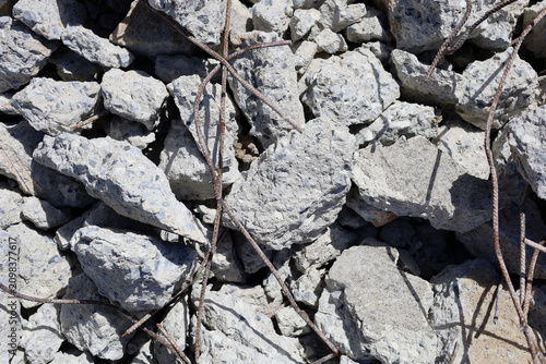 Canvas Print Broken concrete rubble and rebar debris close up