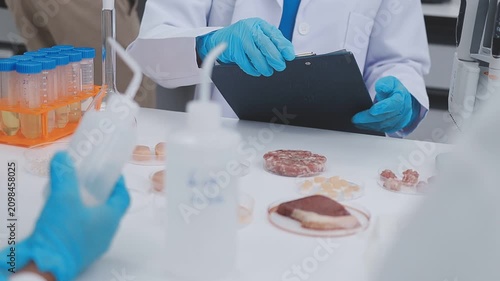Lab technician analyzing food additives in a sterile environment, food safety, scientific food innovation