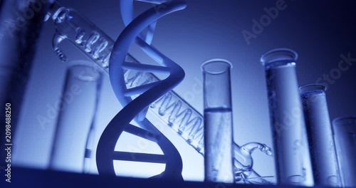Slow motion dna helix model rotating among glass test tubes on laboratory bench with blue backlight scientific technical.