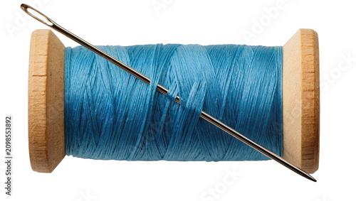 Canvas-taulu Wooden spool with bright blue thread and metal needle, isolated on transparent b