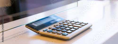 Foto Calculator on White Bank Counter in Wide Banner Frame