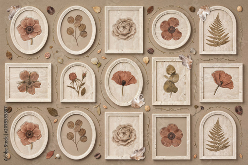 Collection of vintage wooden frames containing pressed dried flowers, ferns, and botanical specimens arranged on a textured light brown background