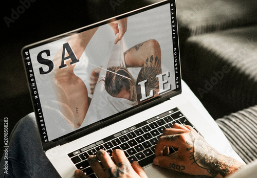 Tattooed Hands Using Laptop Mockup Sale PSD