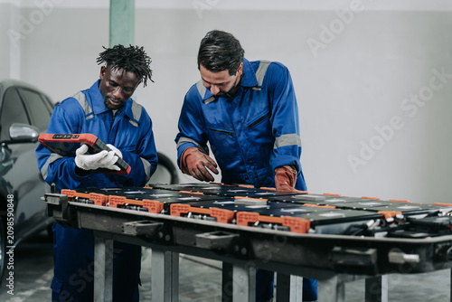 Technicians Diagnosing and Repairing Lithium Ion Car Battery