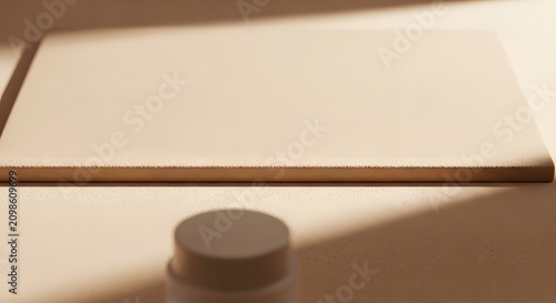 Skincare jar on stone surface with artistic shadows.