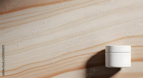 White cosmetic jar on light wood grain surface.