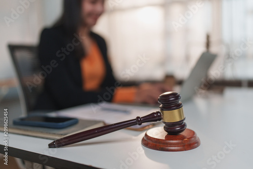 Gavel on desk with lawyer working