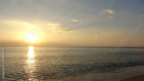 Obraz na plátne Serene Sunrise Beach with Soft Sunlight