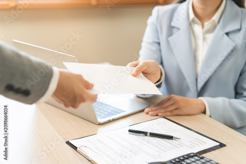 Good job, asian manager business giving financial reward in an envelope, business letter extra salary to company employee, woman worker office hand received premium bonus, getting cheque from her boss