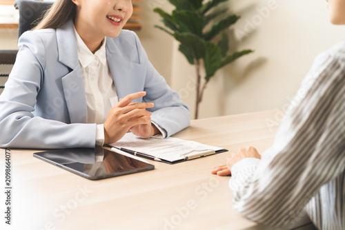 Asian young manager, employer woman interview with person, business owner have question about resume and listen to candidate answer, conversation together at office. Recruitment employee job concept.