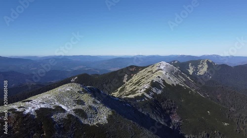 Bird’s eye view of rugged mountain ridge and alpine rocks