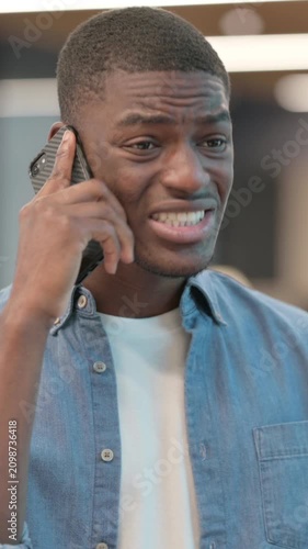 African Man Getting Angry on Phone Call, Vertical Video