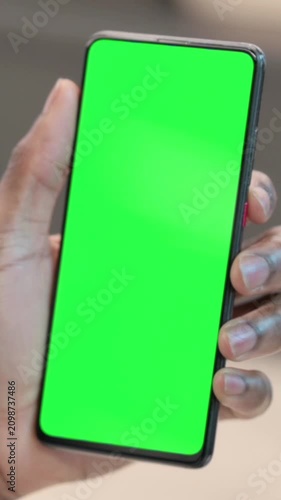 African Man using Smartphone with Green Chroma Key Screen, Vertical Video