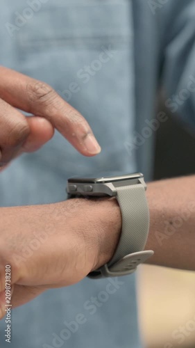 Hands of African Man using Smartwatch, Vertical Video