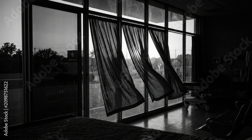 Dramatic Black And White Scene With Waving Curtains And City View