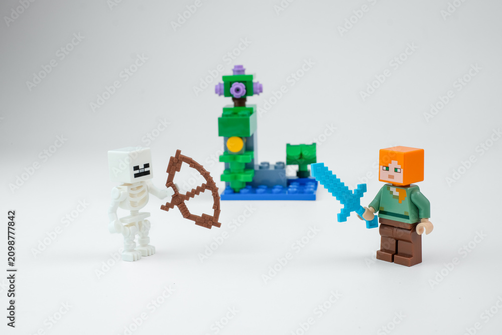 Obraz premium Minecraft-style toy figures show a skeleton with a bow facing a block character holding a blue sword beside a fantasy toy structure on Apr 13, 2026 in Jakarta, Indonesia