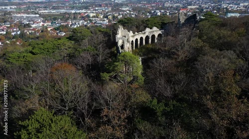 Amphitheater ruins in the middle of the forest with the view of the city, 4k