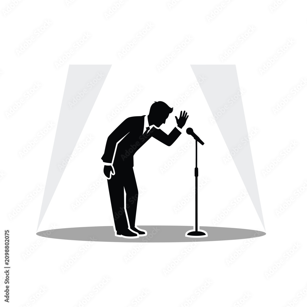 Foto Man bowing at a microphone stand.
