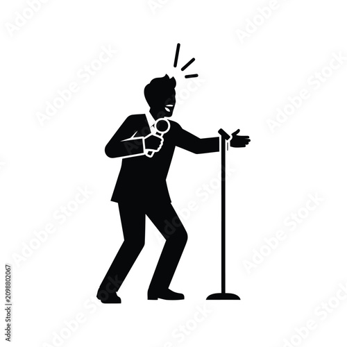 Photos Man singing into a microphone.