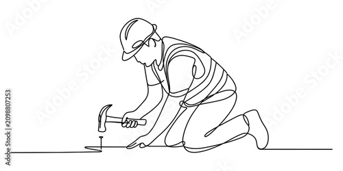 Continuous one line drawing of a construction worker wearing a hard hat using a hammer to drive a nail into the floor for building and home renovation
