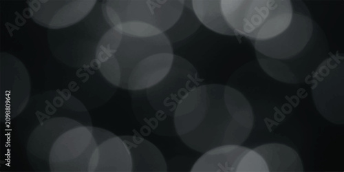 Quadro su tela Soft bokeh circles in dark background during night event creating festive ambian