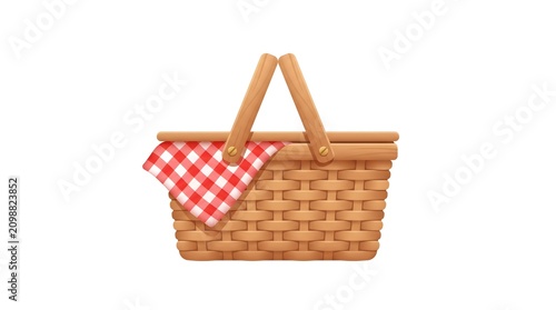 Woven picnic basket with red and white checkered cloth on white background