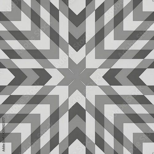 Geometric star kaleidoscope pattern on grey tile surface