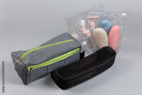 Toiletry bags and clear ziplock bag of travel containers set