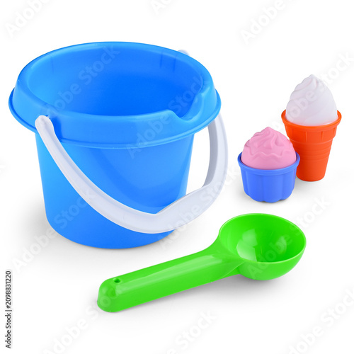 A children's set for playing with sand. Bucket, scoop and ice cream molds on a white background