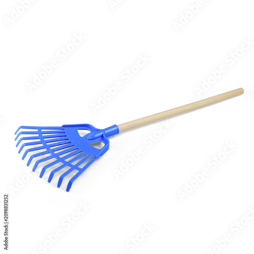 Blue plastic kids leaf rake with wooden handle on white background